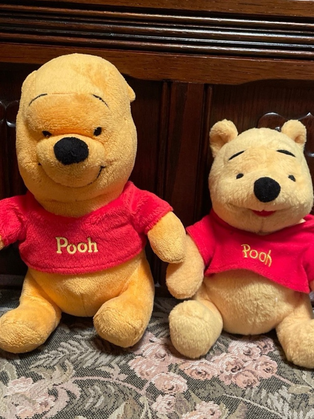 Two Winnie the Pooh bear plush